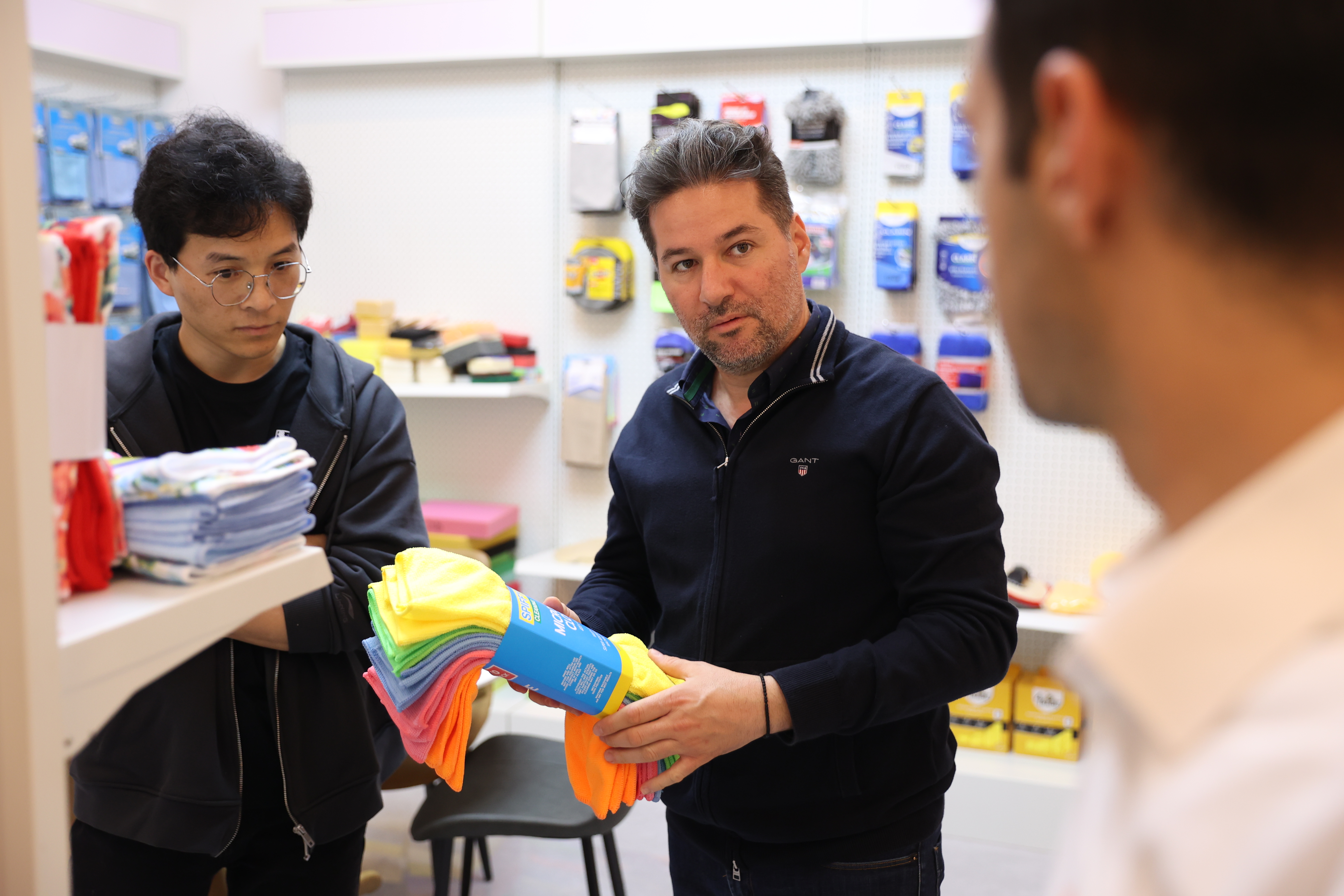 JohnElina team discussing household cleaning products with a supplier